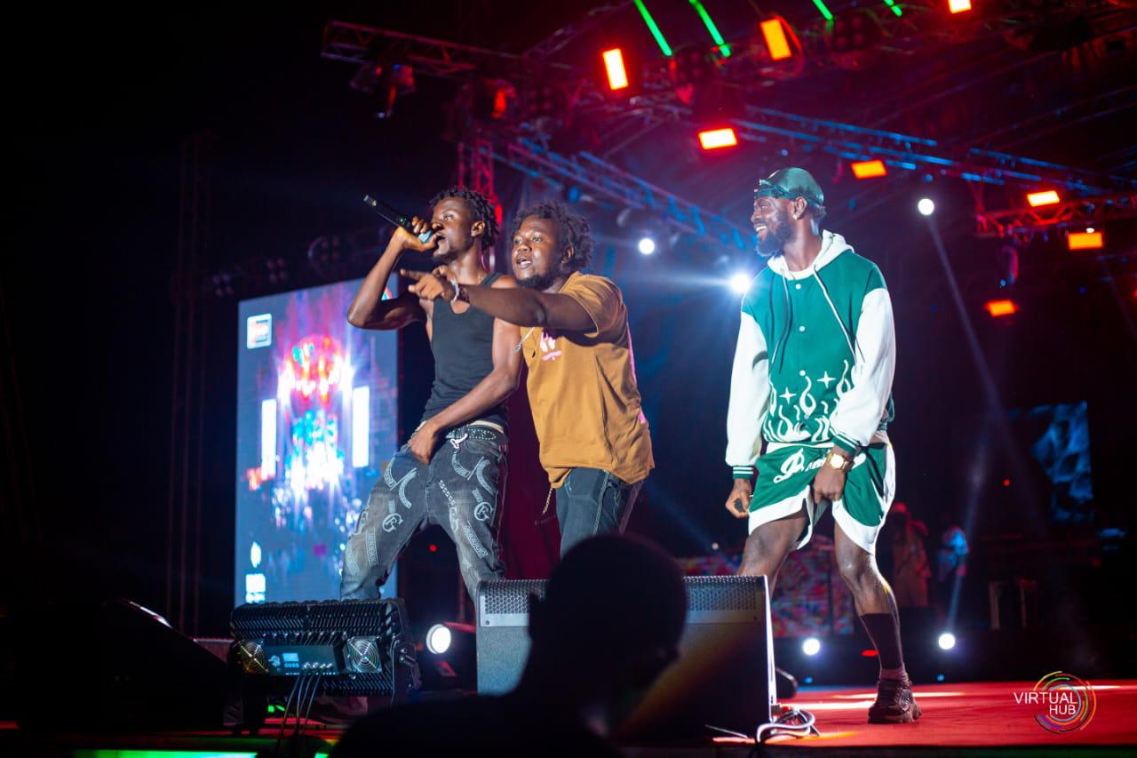 men singing on stage